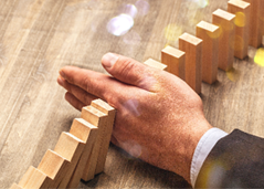 hand through wooden dominos