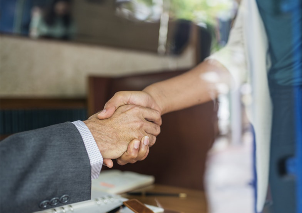 Image of two people shaking hands