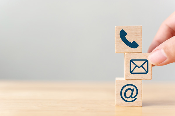 wooden blocks with contact icons
