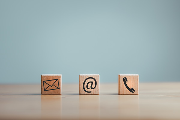 wooden blocks with contact icons