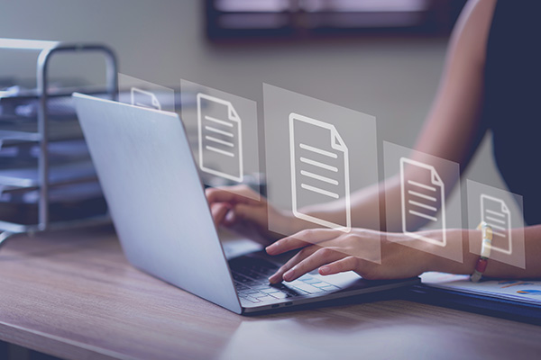 laptop with digital document icons