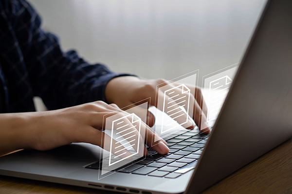 laptop with digital document icons